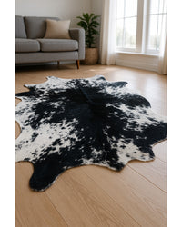 Black Cowhide Animal Print Rug – Stain Resistant, Handmade Low Angle View — cowhide area rug 13