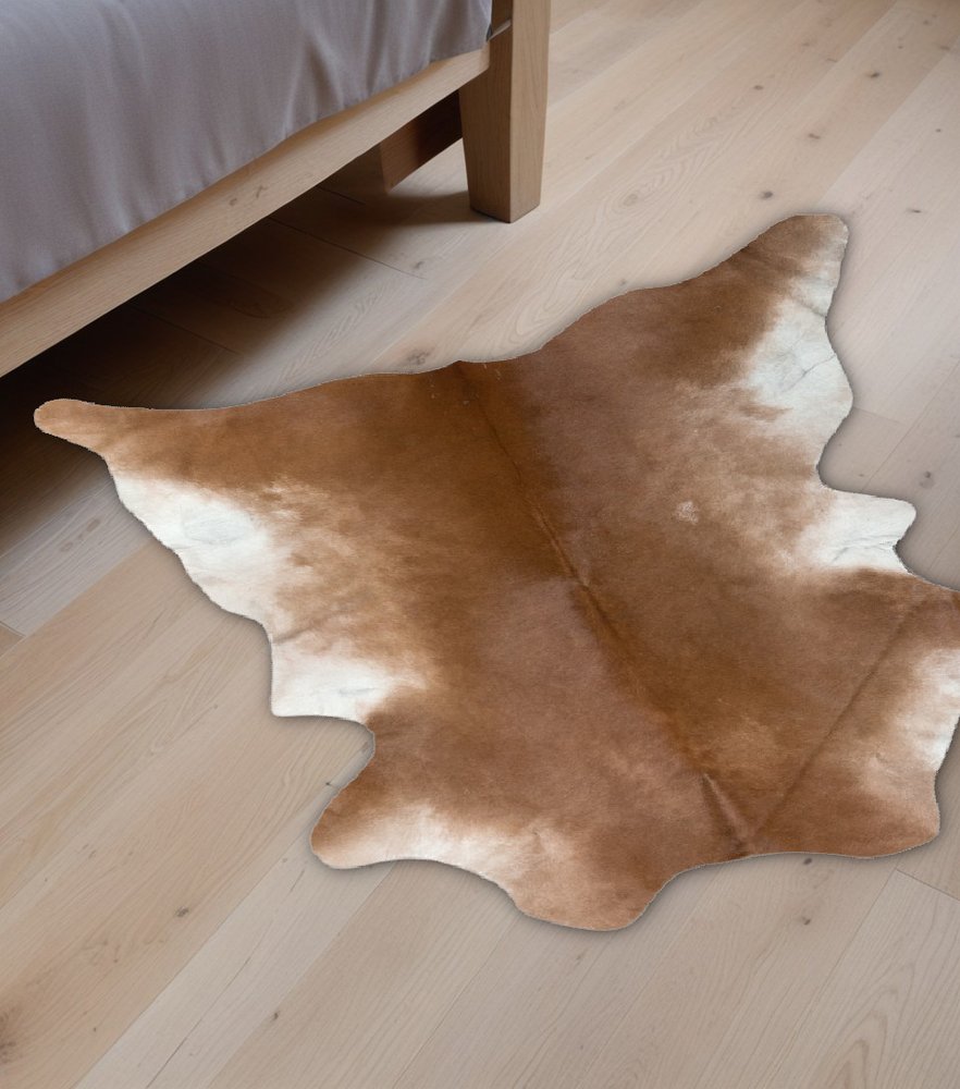 Tan Cowhide Print Area Rug – Soft, Handcrafted Accent