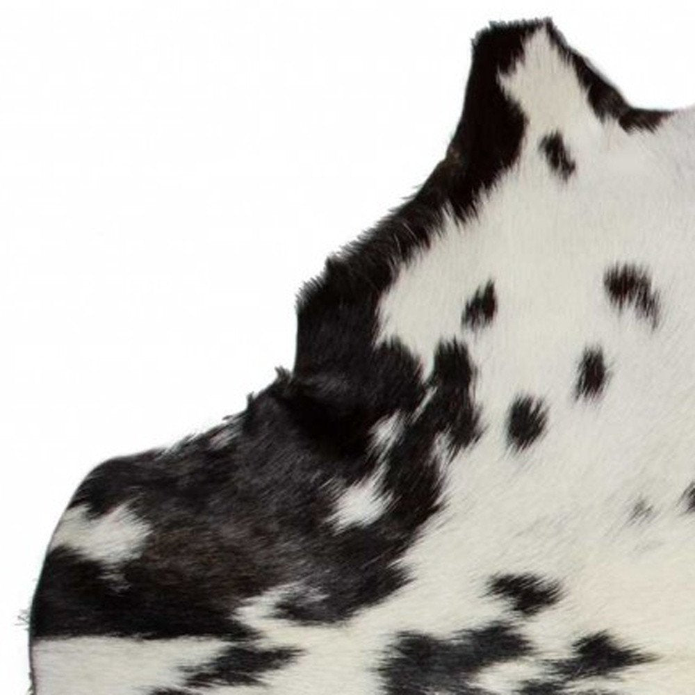 **Black Cowhide Print Handwoven Rug – Modern Accent**