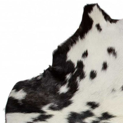 **Black Cowhide Print Handwoven Rug – Modern Accent**