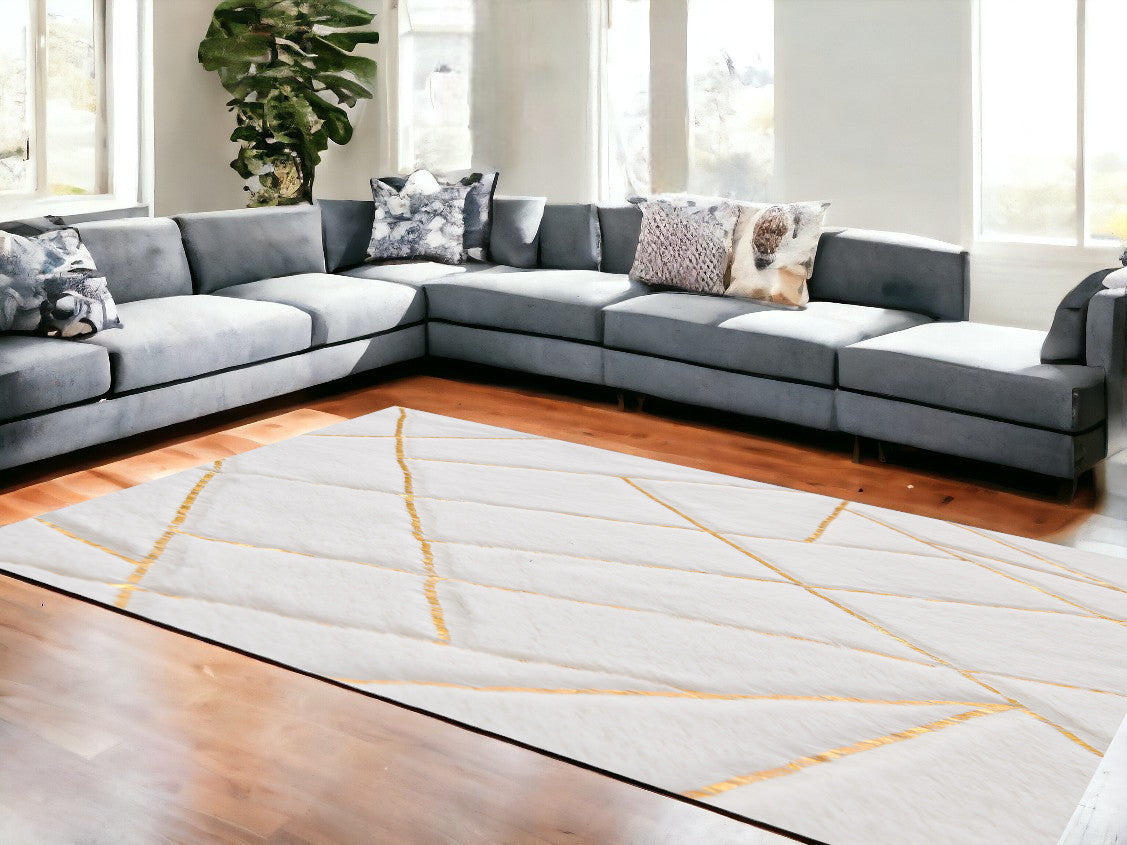 6' X 9' White and Gold Faux Sheepskin Abstract Geometric Machine Tufted Washable Non Skid Area Rug