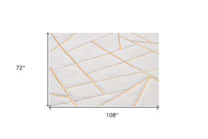 6' X 9' White and Gold Faux Sheepskin Abstract Geometric Machine Tufted Washable Non Skid Area Rug