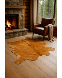 Golden Brown Cowhide Area Rug in Cabin Living Room — cowhide area rug 4