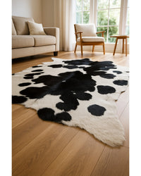 Black Cowhide Area Rug – Handwoven, Stain Resistant Low Angle View — cowhide area rug 20
