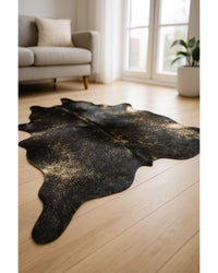 Black Cowhide Print Area Rug – Gold Accents, 5x7 Low Angle View — cowhide area rug 185