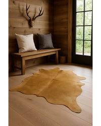 Taupe Cowhide Print Area Rug in Lodge Entryway — cowhide area rug 5