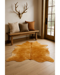 Golden Brown Cowhide Area Rug in Lodge Entryway — cowhide area rug 5