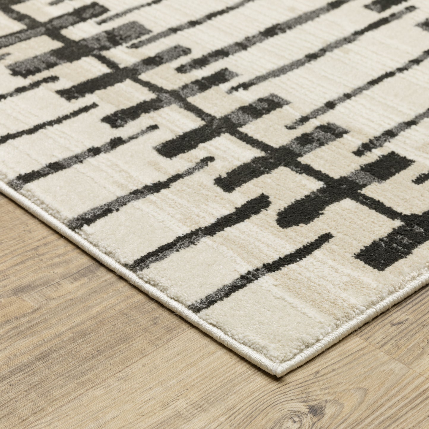 Raylan Ivory Black Modern & Contemporary Geometric Indoor Rug