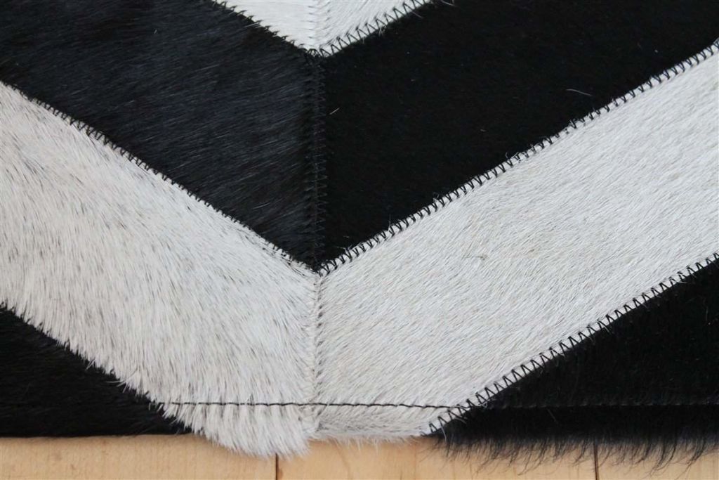 Area Rugs - Madisons Black And White Cowhide Patchwork Rug - Chevron Pattern